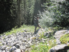 Traversing the slopes.  I really wrenched my left knee on some wet grass and rocks.  The slopes are high-angle, and the grass is slippery.  I never thought I would want to walk over rocks instead of grass, but at least you got traction.