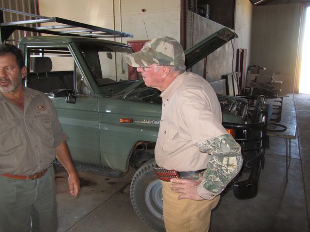 Dad & Corney look over a Landcruiser