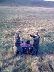 Peter & Cliff confer on hauling critters down.