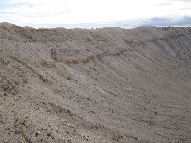 See the rock on the top of the rim at the center (left right) of the picture?  Its the size of a house.