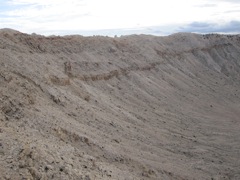 See the rock on the top of the rim at the center (left right) of the picture?  Its the size of a house.