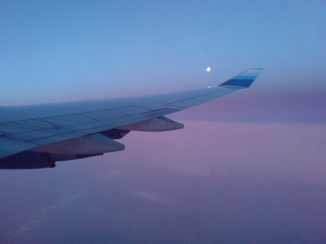 themoonoffthewingofour747atsunrise.jpg