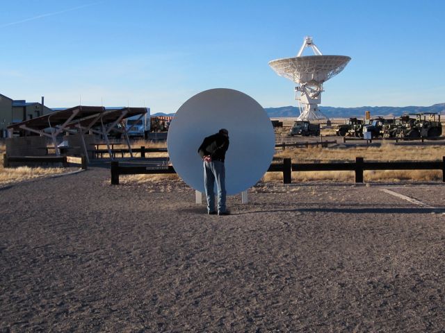 This set of parabolic reflectors allows you to communicate across many yards of separation using the same principles as the antennas.