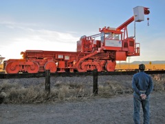 This special built locomotive (one of 2) is used to lift and move the 230 ton antennas off their platforms and roll them to the next spot.  This one is named 