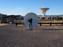 This set of parabolic reflectors allows you to communicate across many yards of separation using the same principles as the antennas.