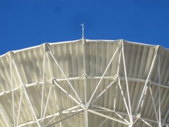 An anemometer is on each dish to detect wind velocity, which can disturb the alignment of the dishes.